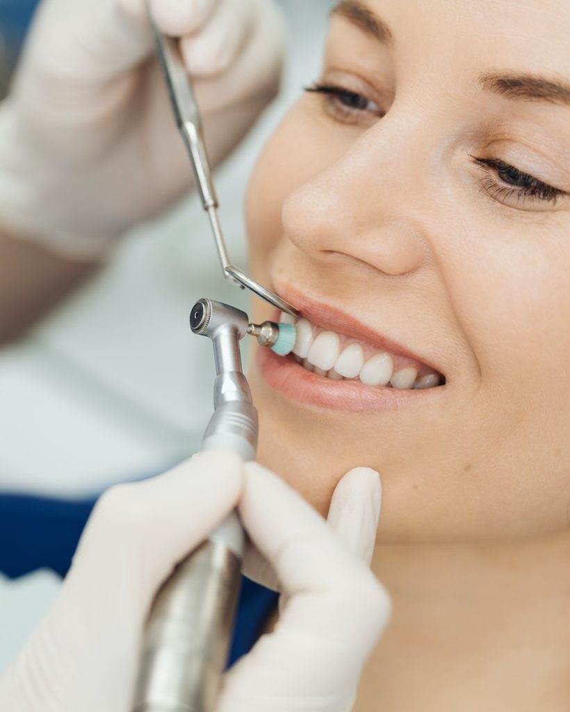 Oral hygiene, dentist doing Scaling and brushing procedure